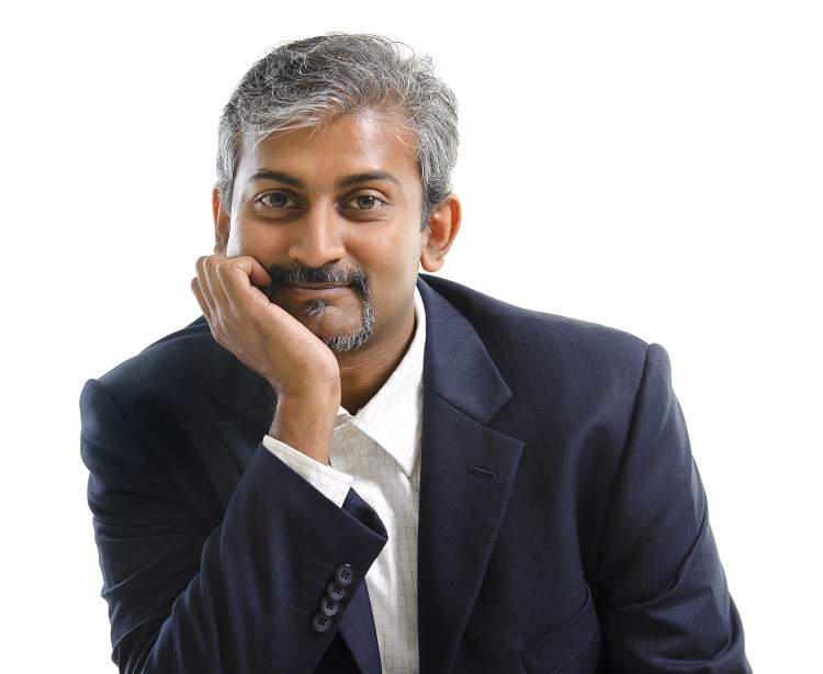 14010905 - mature indian businessman smiling, isolated white background